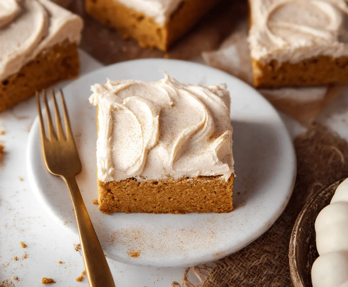 Delicious homemade pumpkin bars topped with creamy brown sugar frosting, perfect for fall desserts and holiday treats.
