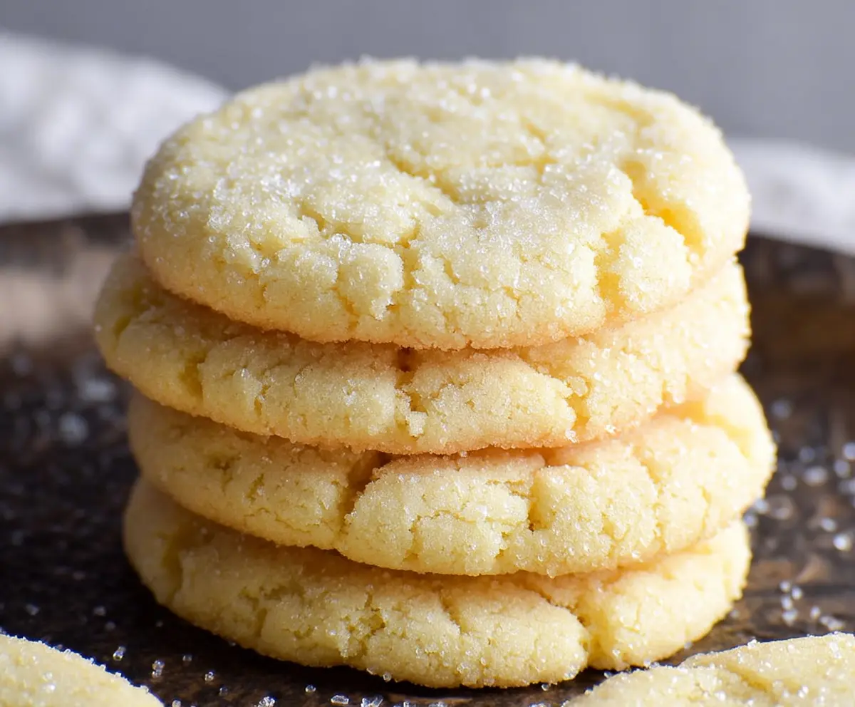 Delicious chewy drop sugar cookies fresh from the oven, showcasing a golden-brown crust and soft center.