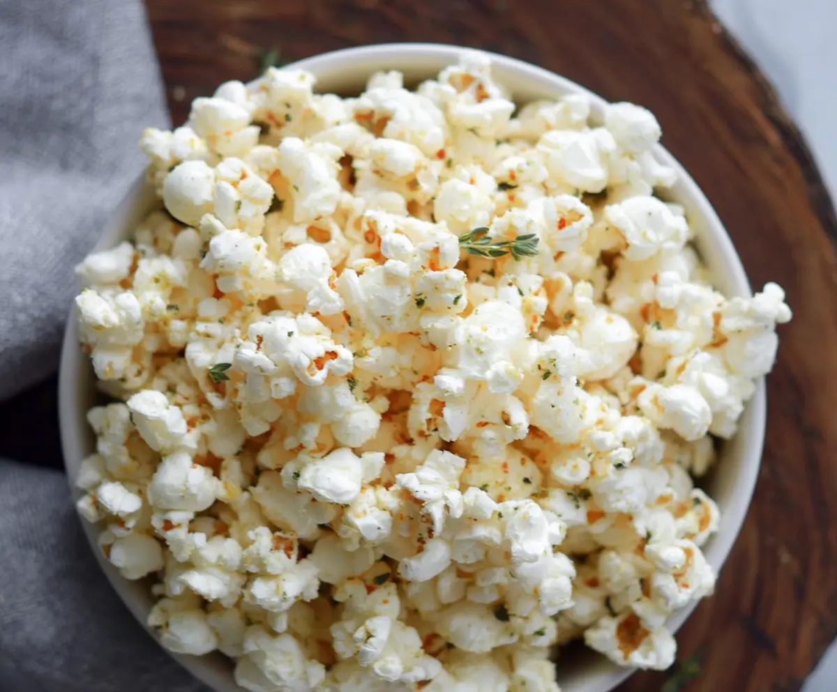 Delicious Parmesan truffle popcorn in a bowl, perfect for movie nights and snack cravings.