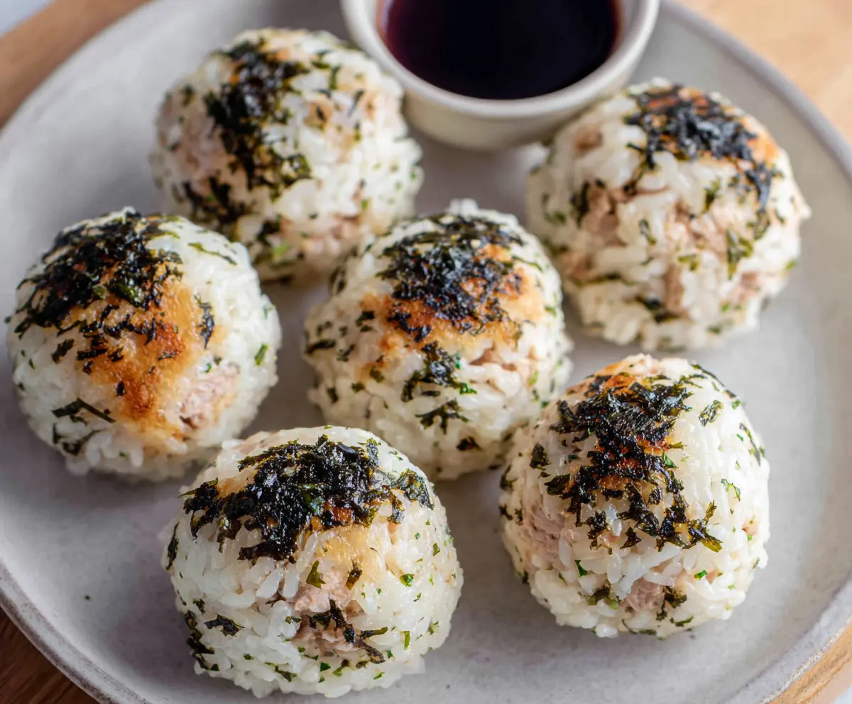 Delicious tuna rice balls on a plate, perfect for a quick Japanese-inspired snack