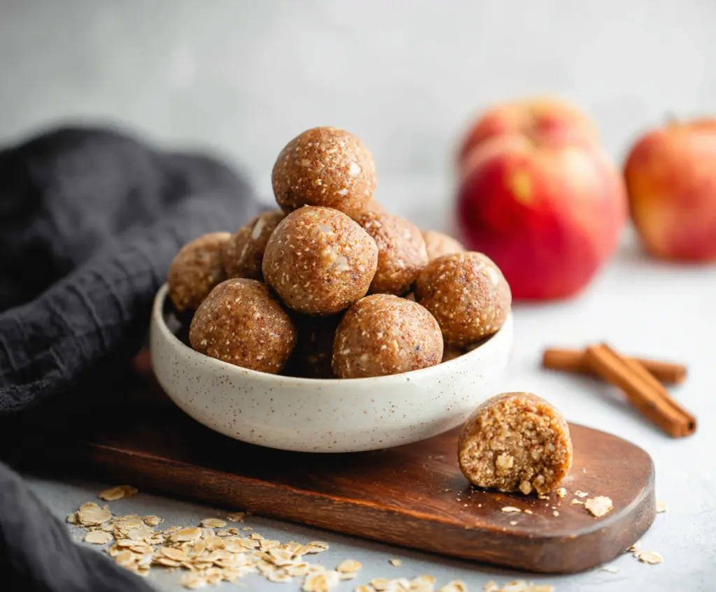 Delicious Apple Pie Protein Bites with a golden crust and apple filling, perfect for a healthy snack.
