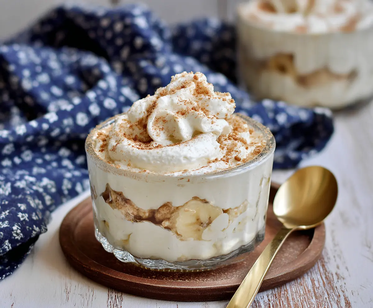 Creamy Cottage Cheese Banana Pudding in a glass serving dish showcasing a smooth, delicious dessert with banana slices on top.