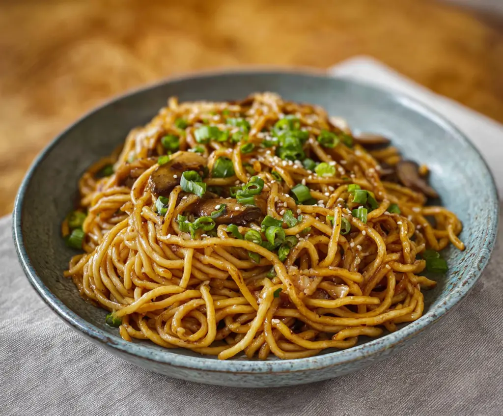 Delicious Japanese garlic fried noodles served on a plate with garnishes