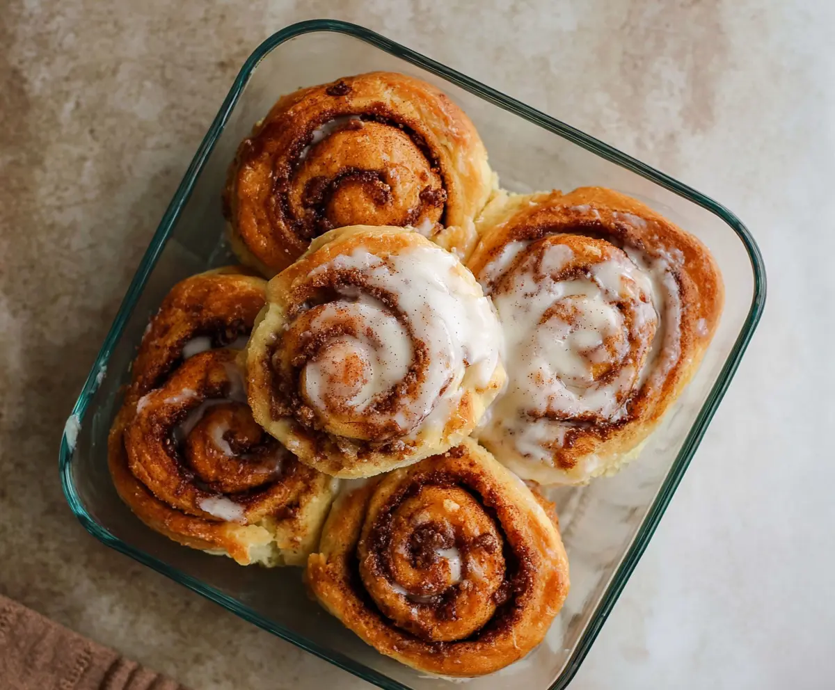 Delicious cottage cheese cinnamon rolls fresh out of the oven, showcasing fluffy texture and cinnamon swirls.