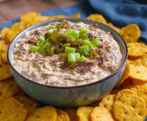 Delicious Mississippi Pot Roast Dip served in a bowl with shredded beef and melted cheese