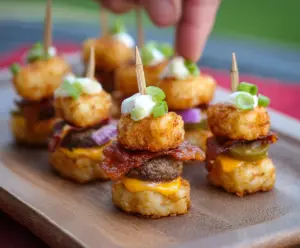 Delicious Tater Tot Mini Cheeseburger Bites served on a platter with melted cheese and fresh toppings
