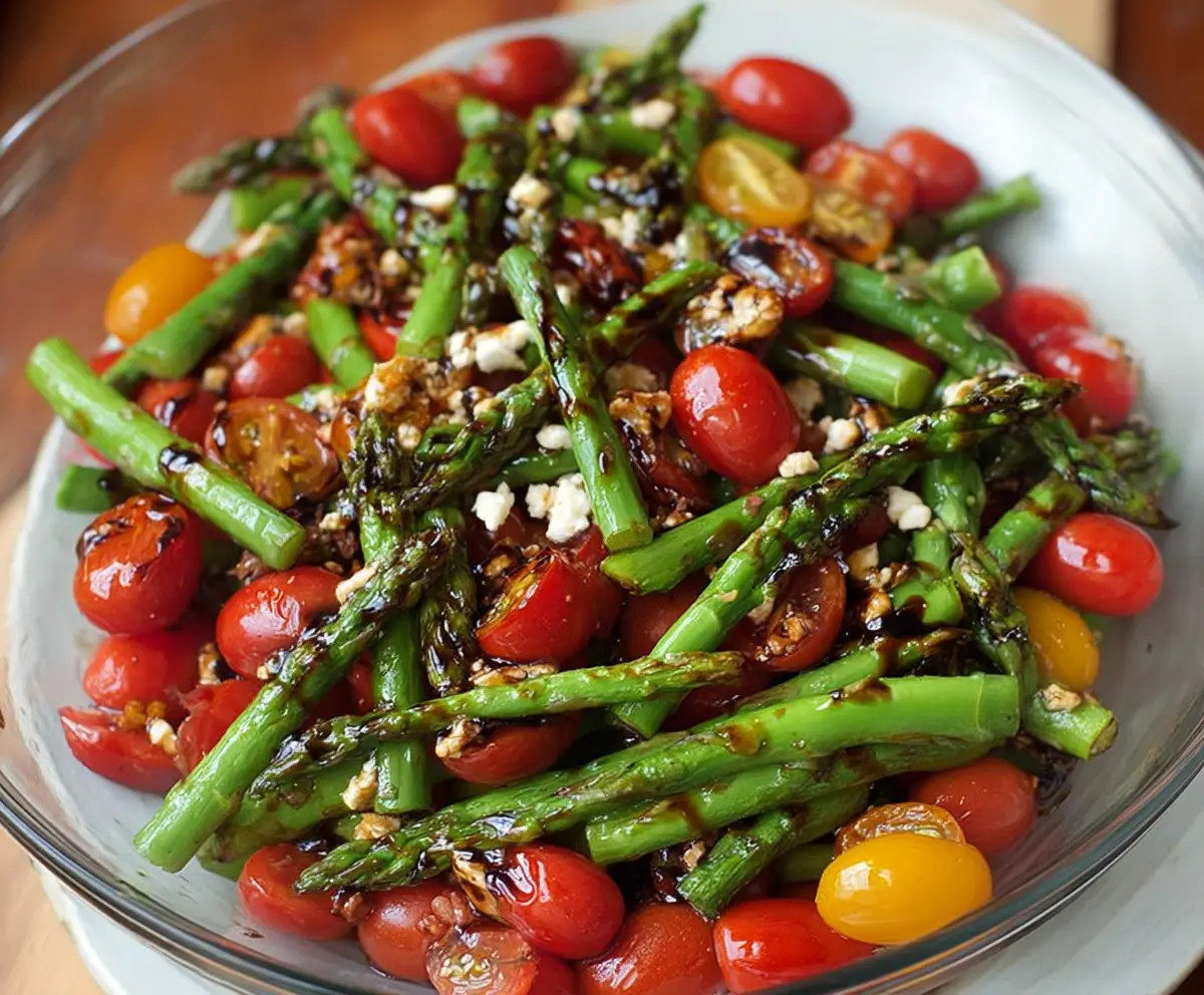 Fresh balsamic asparagus and tomato salad in a bowl, vibrant and healthy.