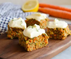 Delicious carrot and zucchini bars topped with citrus cream cheese frosting for a refreshing dessert.